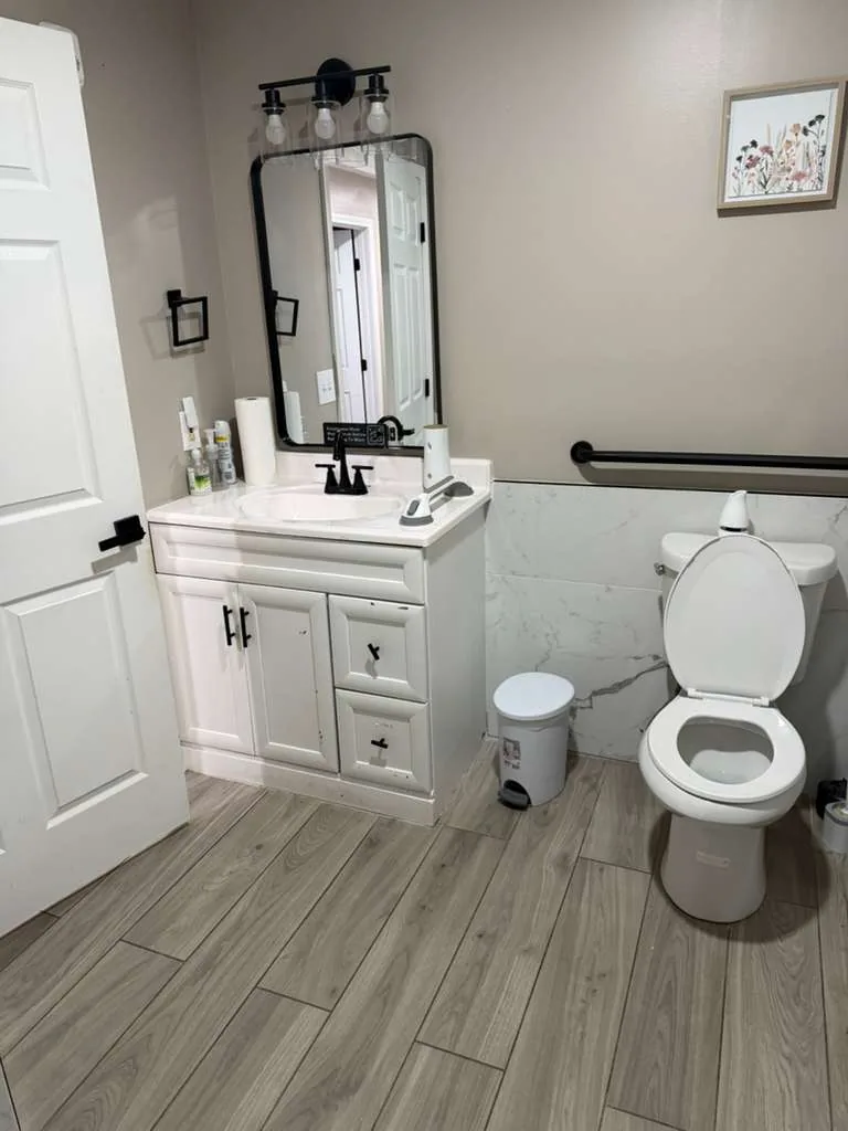 Comfort Cove bathroom with grab bars and accessible layout.