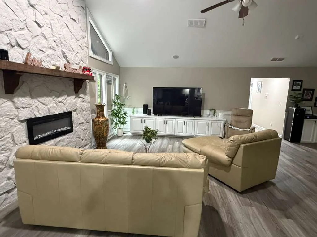 Comfortable seating and fireplace in the Comfort Cove living room.